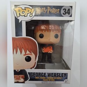 Funko George Weasley Figure with Weasleys Wizard Wheezes Boxes. New In Box.
